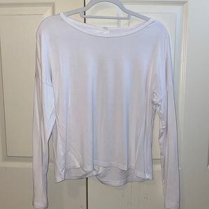 White size medium women’s long sleeve with an open back.